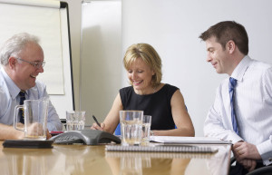 Staff at PPM Systems in meeting around table